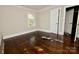A bright bedroom featuring hardwood floors and a window for natural light, creating a comfortable space at 506 E Ridge St, Kings Mountain, NC 28086