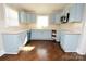 Updated kitchen showcases updated cabinets and fixtures at 506 E Ridge St, Kings Mountain, NC 28086