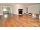 Spacious living room featuring an inviting fireplace, opening to a well-lit and updated kitchen at 506 E Ridge St, Kings Mountain, NC 28086