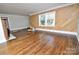 Spacious living room boasts hardwood floors, large window with a view and a unique fireplace at 506 E Ridge St, Kings Mountain, NC 28086
