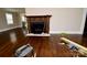 Living room featuring hardwood floors and a unique decorative fireplace at 506 E Ridge St, Kings Mountain, NC 28086