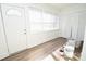 This sun room offers natural light, wood floors, and ample space for relaxation at 506 E Ridge St, Kings Mountain, NC 28086