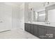 Stylish bathroom with double vanity, marble countertops, and modern fixtures at 5233 Glenwalk Dr # 0063, Charlotte, NC 28269