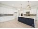 Spacious kitchen with white cabinetry, stainless steel appliances, and a large central island at 5233 Glenwalk Dr # 0063, Charlotte, NC 28269