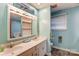 Bright bathroom offers dual sinks and ample counter space with an ocean-themed decor at 623 Spring Sw St, Concord, NC 28025