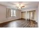 Spacious bedroom features hardwood floors, large windows, and double closets at 623 Spring Sw St, Concord, NC 28025