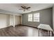 Bedroom with wood floors, ceiling fan, and closets offer ample storage and comfort at 623 Spring Sw St, Concord, NC 28025