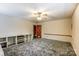 Spacious bedroom featuring neutral walls and carpet, with custom built-in shelving and trim work at 623 Spring Sw St, Concord, NC 28025