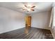 Bright bedroom features hardwood floors, a ceiling fan, and a neutral color scheme at 623 Spring Sw St, Concord, NC 28025