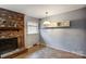Cozy dining area with a charming brick fireplace, and a modern chandelier for Gathering meals at 623 Spring Sw St, Concord, NC 28025