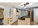 Well-lit kitchen equipped with tile floors, granite countertops, modern appliances, and ample cabinet space at 623 Spring Sw St, Concord, NC 28025