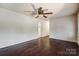 Spacious living room featuring beautiful hardwood floors, ceiling fan, and neutral wall color at 623 Spring Sw St, Concord, NC 28025