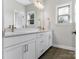 Bathroom featuring a double sink vanity, Herringbone tile floors, and mirror at 7206 Sumters Camp Trl, Fort Mill, SC 29707