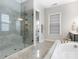 Modern bathroom featuring a glass shower, stone bench, and double vanity at 7206 Sumters Camp Trl, Fort Mill, SC 29707