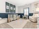 Well decorated room with crib, large rug, chair, and wainscotting at 7206 Sumters Camp Trl, Fort Mill, SC 29707