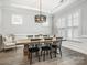 Elegant dining room featuring modern chandelier and ample seating at 7206 Sumters Camp Trl, Fort Mill, SC 29707