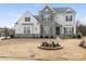 Two story home featuring stone and vinyl siding, complemented by manicured landscaping at 7206 Sumters Camp Trl, Fort Mill, SC 29707