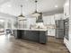 Sleek kitchen featuring a large center island, stainless steel appliances, and ample counter space at 7206 Sumters Camp Trl, Fort Mill, SC 29707