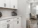 Convenient kitchenette area with white cabinets and a cozy seating area at 7206 Sumters Camp Trl, Fort Mill, SC 29707