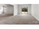 Spacious living room with large window overlooking fenced backyard at 7206 Sumters Camp Trl, Fort Mill, SC 29707