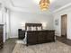 Comfortable bedroom features a tray ceiling, a large bed, and ample natural light at 7206 Sumters Camp Trl, Fort Mill, SC 29707