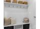 Organized mudroom area with hooks, storage baskets, and a built-in bench at 7206 Sumters Camp Trl, Fort Mill, SC 29707