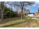 The home features a large backyard surrounded by mature trees, offering privacy and a sense of tranquility at 7544 Yellow Pine Ct, Charlotte, NC 28277