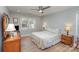 Comfortable bedroom with a ceiling fan and natural light from the window at 7544 Yellow Pine Ct, Charlotte, NC 28277