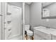 A recently updated bathroom featuring a walk-in shower and a single sink vanity with white cabinets at 909 Laye St, Belmont, NC 28012