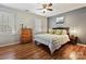 Comfortable bedroom with hardwood floors, ample natural light, and stylish furniture at 9112 Nolley Ct # F, Charlotte, NC 28270