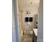 Cozy bathroom with shower and tub, cabinet storage, and decorative nautical accents at 9709 Emerald Point Dr # 2, Charlotte, NC 28278