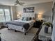 Comfortable bedroom featuring a ceiling fan, large windows, and neutral decor at 9709 Emerald Point Dr # 2, Charlotte, NC 28278