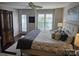 Well-lit bedroom featuring plantation shutters, and an en-suite balcony overlooking the lake at 9709 Emerald Point Dr # 2, Charlotte, NC 28278