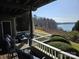 Outdoor deck with comfortable seating and scenic lake views perfect for relaxing or entertaining guests at 9709 Emerald Point Dr # 2, Charlotte, NC 28278