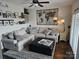 Comfortable living room with large sectional sofa and decorative accents including a wooden world map at 9709 Emerald Point Dr # 2, Charlotte, NC 28278