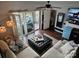 Comfortable living room with large sectional sofa, mini fridge, and access to a private outdoor deck at 9709 Emerald Point Dr # 2, Charlotte, NC 28278