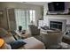 Comfortable living room with fireplace and serene lake views at 9709 Emerald Point Dr # 2, Charlotte, NC 28278