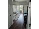Living room featuring hardwood floors, ample natural light, and access to an outdoor balcony at 9709 Emerald Point Dr # 2, Charlotte, NC 28278