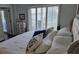Bright bedroom with large windows, comfortable bed, and stylish decor, flooded with natural light at 9709 Emerald Point Dr # 2, Charlotte, NC 28278