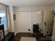 Bright office space featuring a large closet, whiteboard, neutral colors, and dark wood floors at 9709 Emerald Point Dr # 2, Charlotte, NC 28278