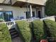 Exterior patio featuring comfortable seating, a shaded area, and manicured landscaping at 9709 Emerald Point Dr # 2, Charlotte, NC 28278