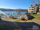 Lakeside community pool and brick pool house building by the water's edge at 9709 Emerald Point Dr # 2, Charlotte, NC 28278