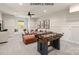 Finished basement featuring a cozy seating area, foosball table, and stylish decor at 11016 Tyler Brook Ln # Oak0036, Mint Hill, NC 28227