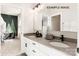 Bright bathroom with double vanity and view into bedroom at 11016 Tyler Brook Ln # Oak0036, Mint Hill, NC 28227