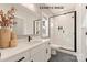 Modern bathroom with a white vanity, glass shower, and black fixtures at 11016 Tyler Brook Ln # Oak0036, Mint Hill, NC 28227