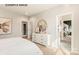 Bright bedroom with access to an ensuite bathroom, featuring a large dresser at 11016 Tyler Brook Ln # Oak0036, Mint Hill, NC 28227
