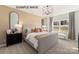 Comfortable bedroom with natural light, neutral colors, carpet floor, and stylish furnishings at 11016 Tyler Brook Ln # Oak0036, Mint Hill, NC 28227