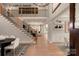Open foyer with hardwood floors, staircase and view into the living room at 11016 Tyler Brook Ln # Oak0036, Mint Hill, NC 28227