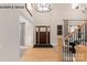 Bright and inviting foyer featuring hardwood floors, high ceilings, and elegant chandelier at 11016 Tyler Brook Ln # Oak0036, Mint Hill, NC 28227