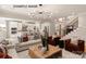 Open concept living room featuring modern lighting, hardwood floors, staircase and seamless flow into the kitchen at 11016 Tyler Brook Ln # Oak0036, Mint Hill, NC 28227